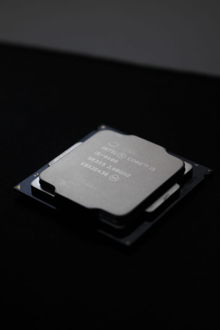 about-01 Detailed close-up image of a computer processor chip on a dark background.